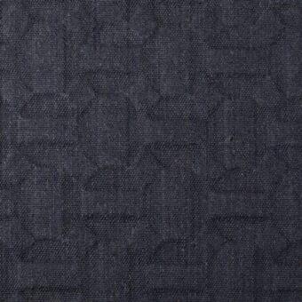 Dark gray geometric fabric sample features a dense, raised square pattern with tonal variations; Bonaldo Flora Metalasse eb34.